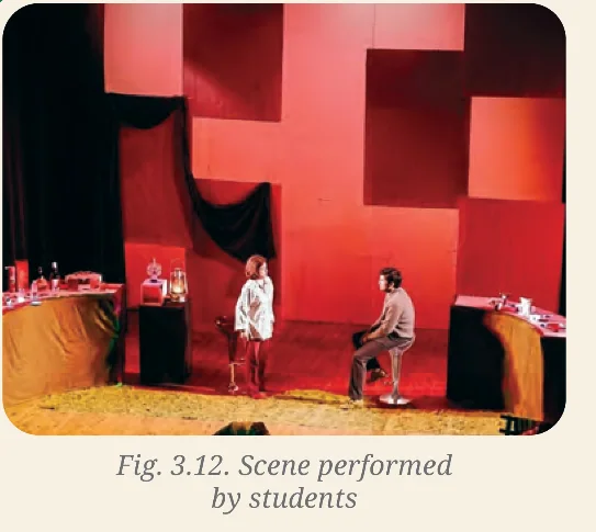 A red and black stage scene performed by students